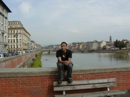 Your euphoric web designer by the river Arno in Florence